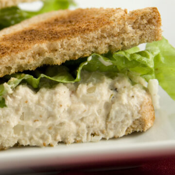 Closeup of Simple Weight Watchers Lemon Pepper Tuna Salad Sandwich on a white plate.