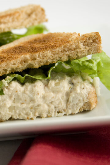 Closeup of Simple Weight Watchers Lemon Pepper Tuna Salad Sandwich on a white plate.