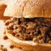 Closeup of Easy Weight Watchers Sloppy Joes (Slow Cooker) on a cutting board.