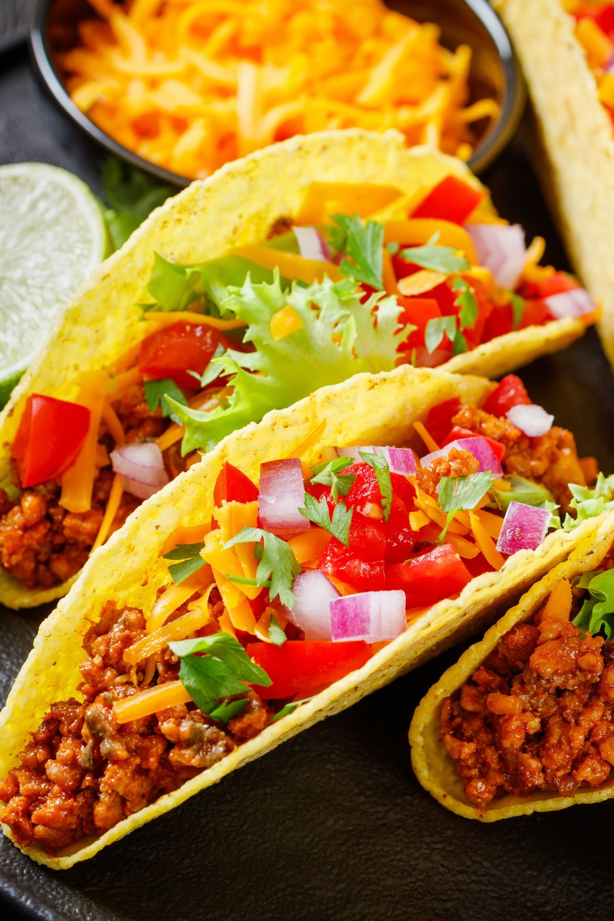 Overhead view of Spicy Weight Watchers Ground Beef Taco Meat in hard corn taco shells.