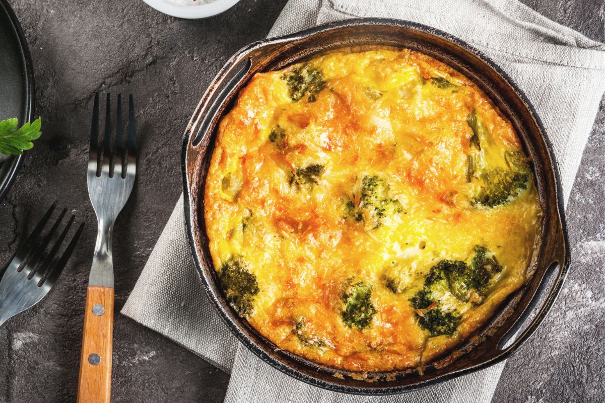 Weight Watchers Cheesy Cheddar Broccoli Frittata in a cast iron pan with forks next to it.