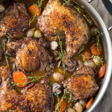 Closeup overhead view of Best Weight Watchers Coq Au Vin in a dutch oven.