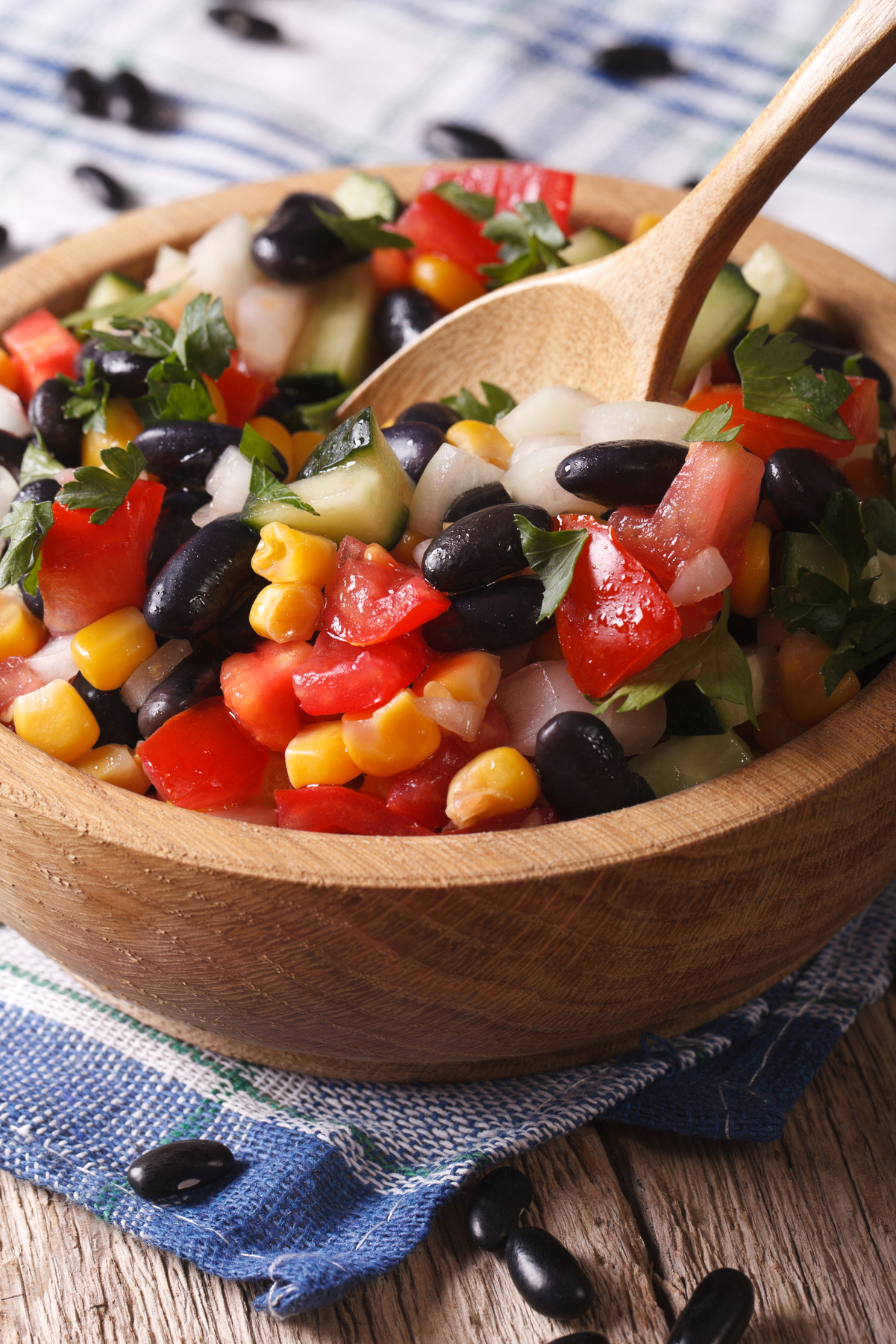 Easy Black Bean and Corn Salsa (Weight Watchers) in a wooden bowl with a wooden spoon in it.