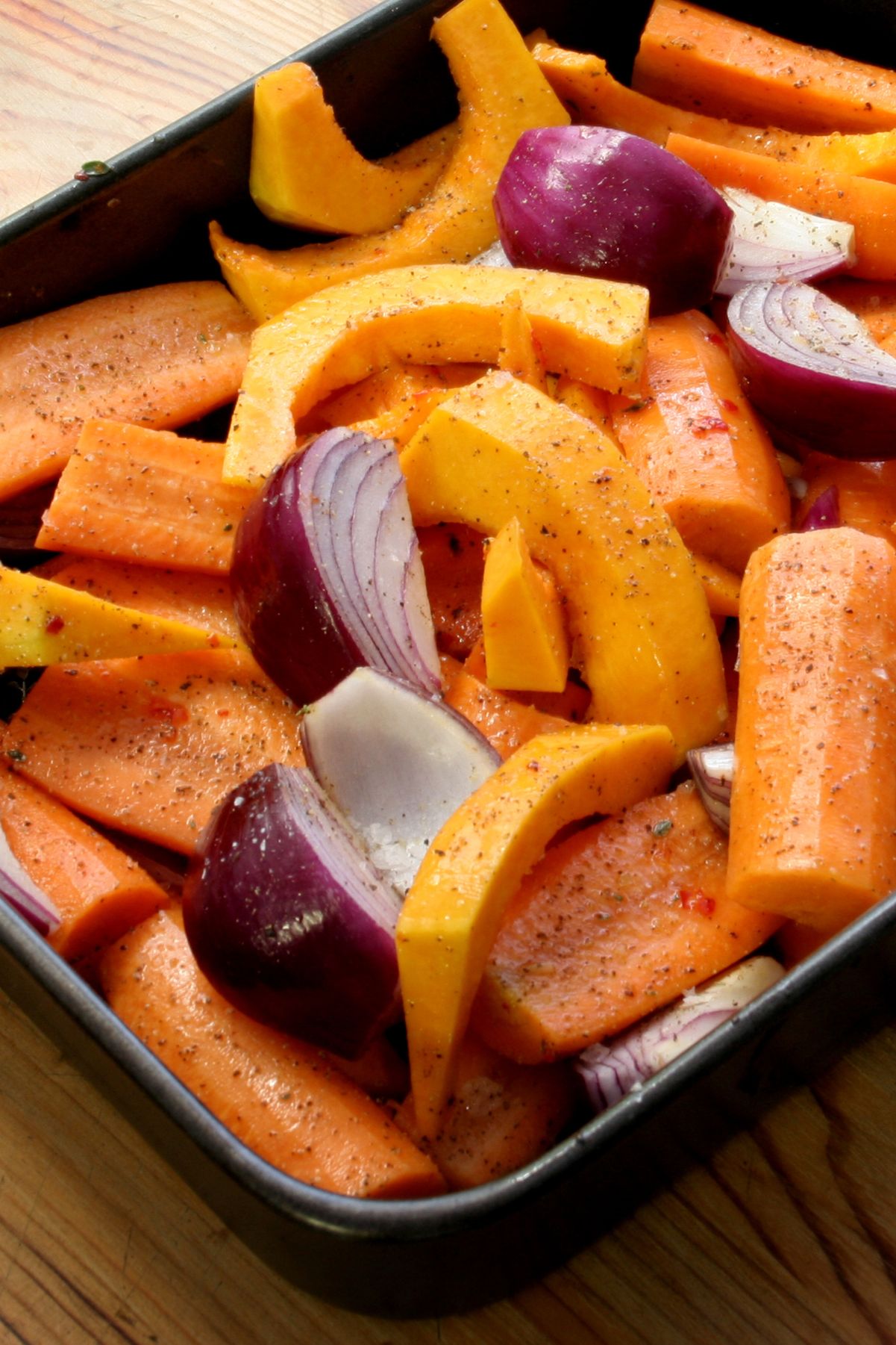 Roasted Butternut Squash and Carrots in a square, black bowl.