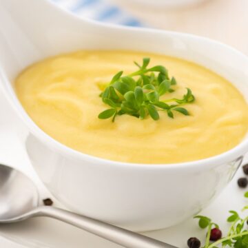 closeup of Simple Hollandaise Sauce (Weight Watchers) in a white bowl.