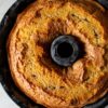 Over head view of Weight Watchers Favorite Coffee Cake in a black bundt pan.