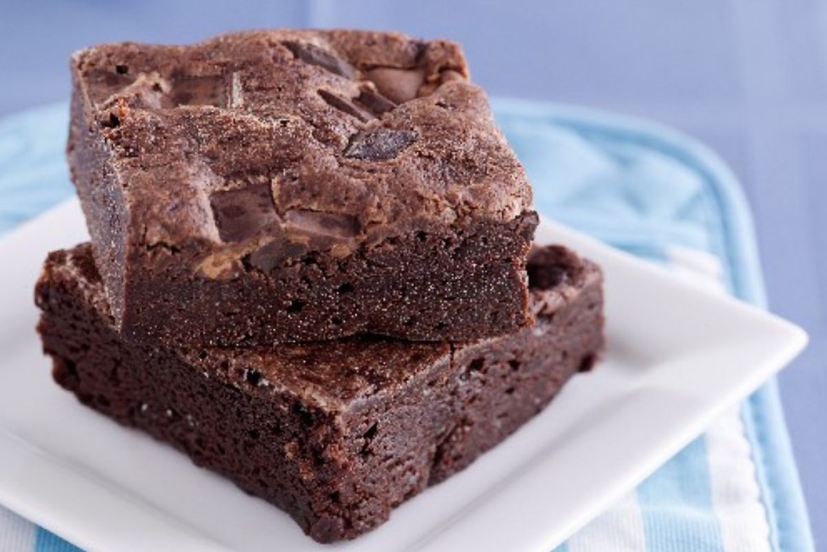 A stack of 2 Weight Watchers Black Bean Brownies on a white plate.