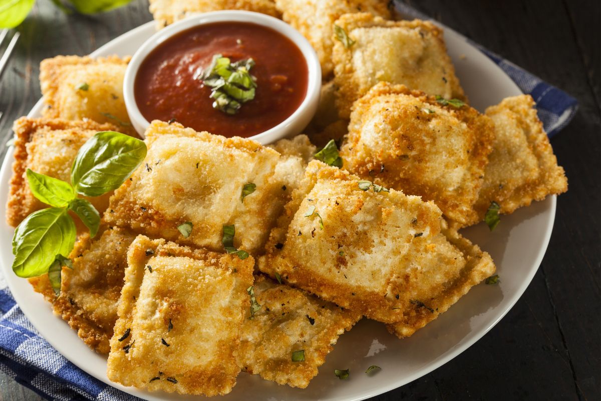 Weight Watchers Baked Ravioli with Marinara Sauce on a white plate.