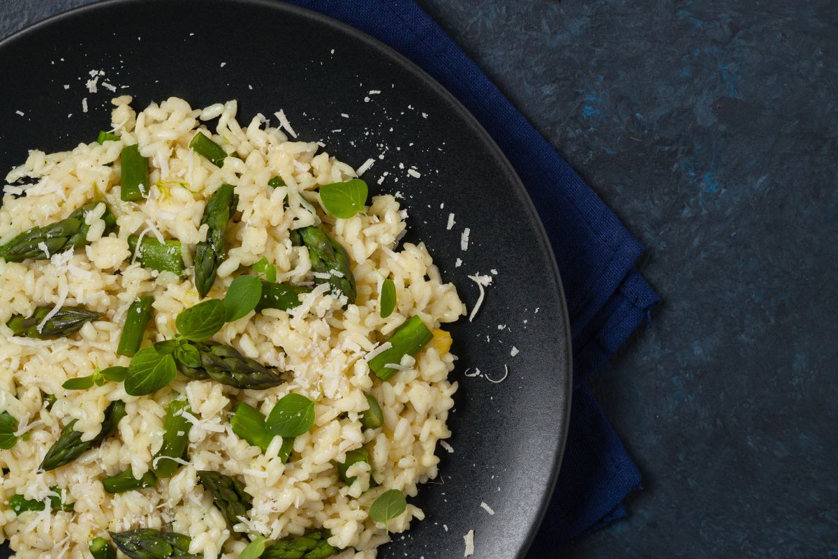 Closeup of Weight Watchers Creamy Asparagus Risotto in a black bowl.