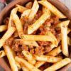 Closeup of Weight Watchers Penne Pasta with Meat Sauce in a brown bowl.
