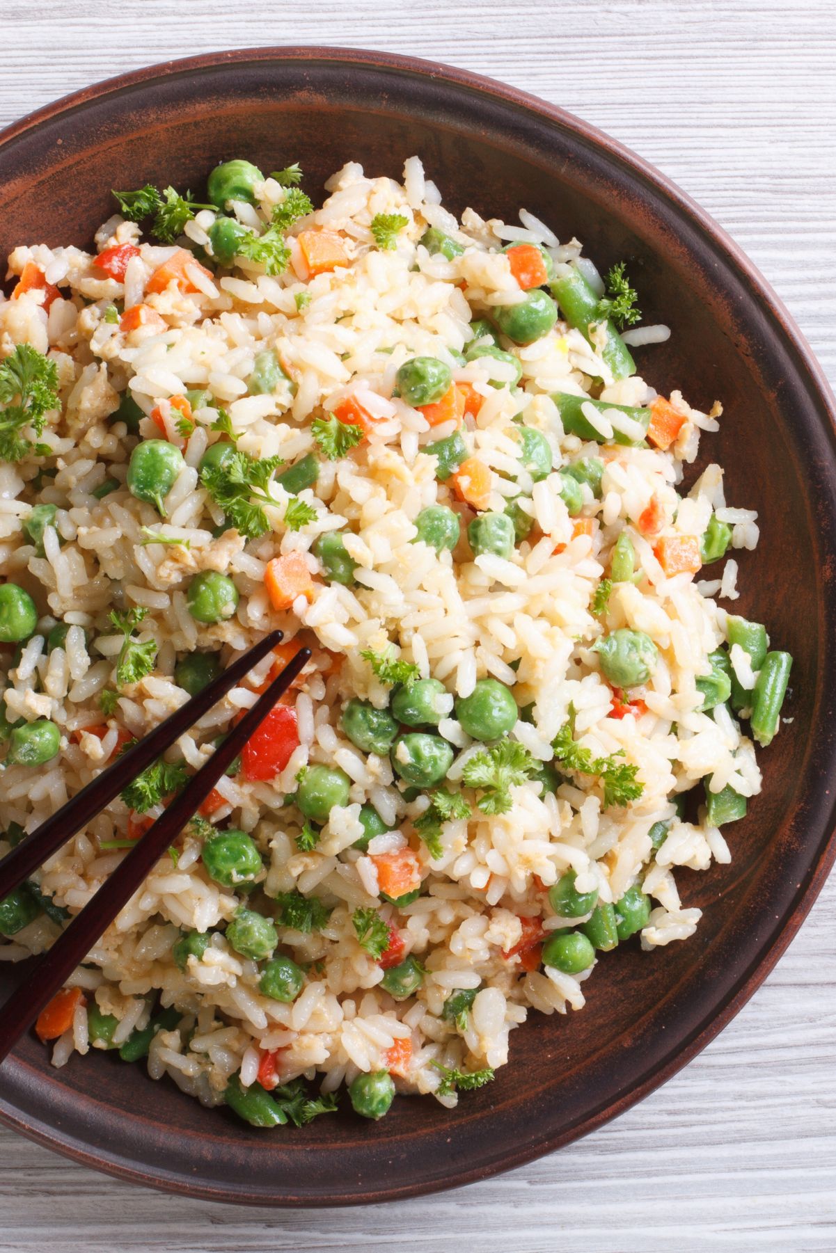 Closeup of Weight Watchers Quick and Easy Fried Rice in a brown bowl.