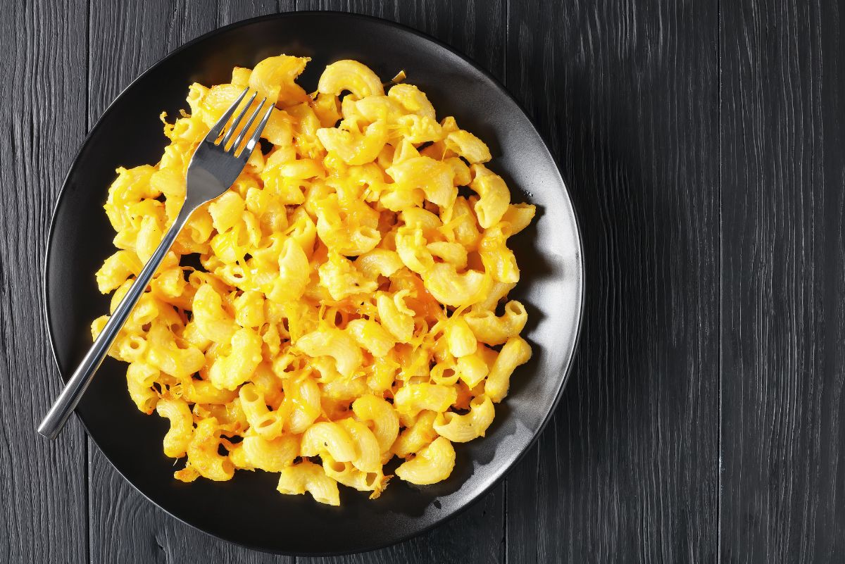 Easy Weight Watchers Macaroni and Cheese in a black bowl with a black background.