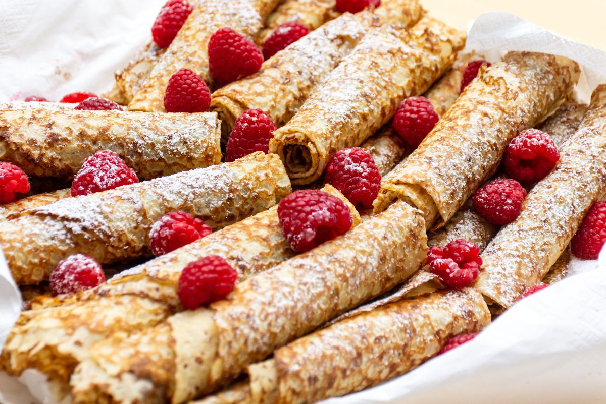 Weight Watchers Healthier Raspberry Crepes in a cloth napkin lined dish.