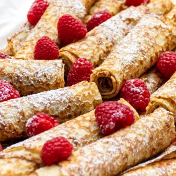 Closeup of Weight Watchers Healthier Raspberry Crepes on a white linen napkin.