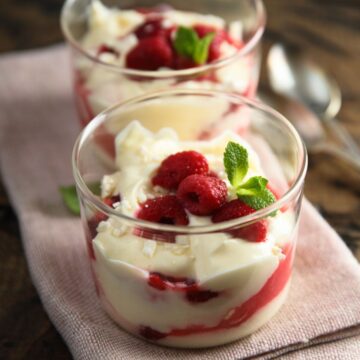 2 Weight Watchers Raspberry Pudding Cups on a cloth napkin.