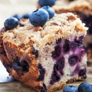 Closeup of Weight Watchers Blueberry Coffee Cake (Slow Cooker) with fresh blueberries around it.