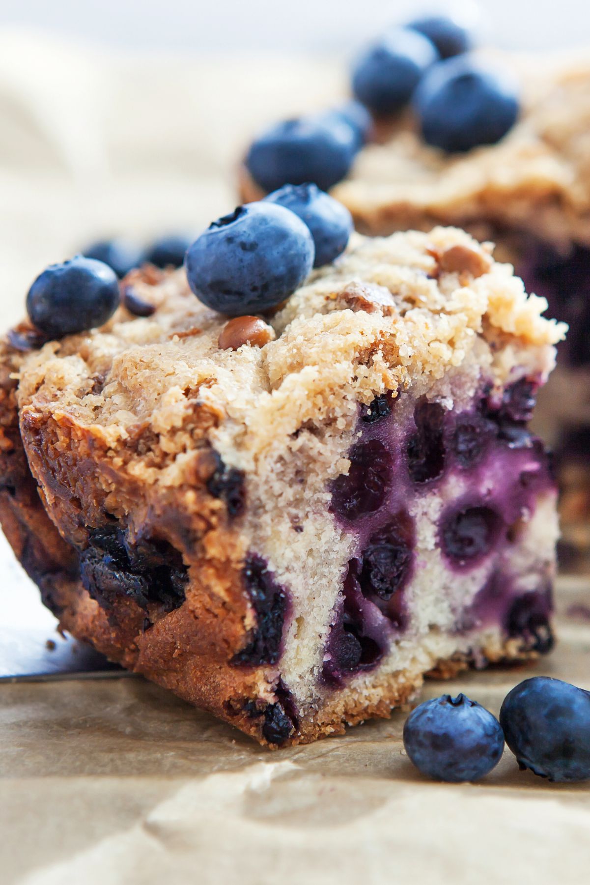 Closeup of Weight Watchers Blueberry Coffee Cake (Slow Cooker) with fresh blueberries around it.