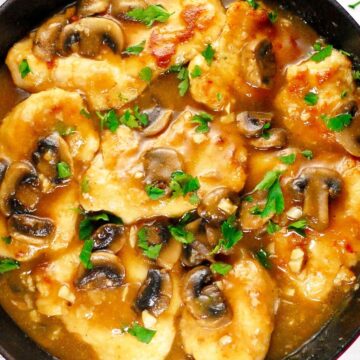 Graphic for Pinerest of Weight Watchers Italian Skillet Chicken Marsala in a black skillet on a light background.