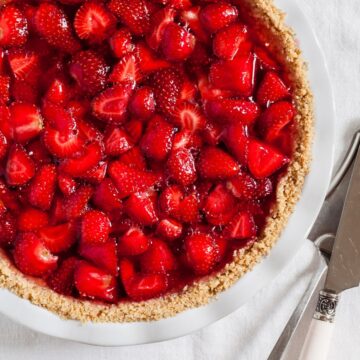 Overhead view of Best Weight Watchers Strawberry Pie on a white tablecloth.