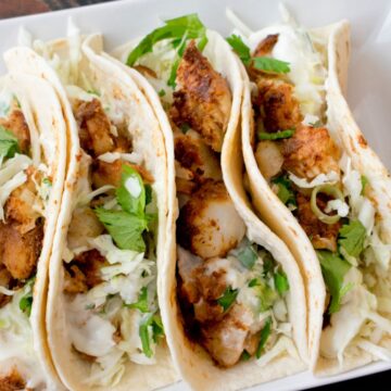 California Style Fish Tacos on a white plate.