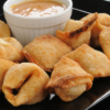 Closeup of Weight Watchers Crab Rangoon Appetizer on a black plate.