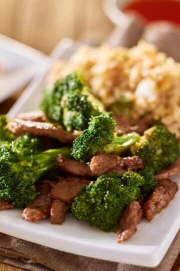 Closeup of Weight Watchers Orange Sirloin Beef and Broccoli on a white plate.