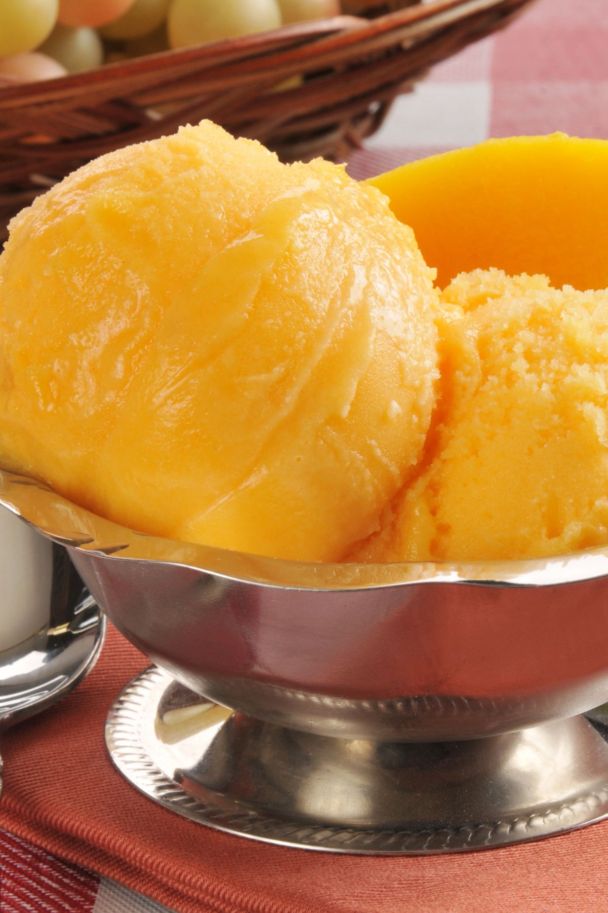 3 Scoops of Weight Watchers Mango Sorbet in a silver Ice cream dish.