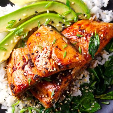 Closeup of Weight Watchers Spicy Grilled Salmon with Sesame Sauce on a bed of rice.