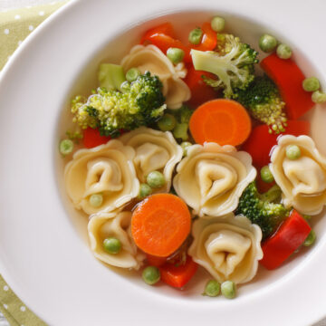 Weight Watchers Chicken and Tortellini Soup in a white bowl.