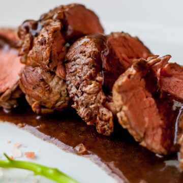 Closeup of Weight Watchers Filet Mignon and Burgundy Wine Sauce on a white plate.