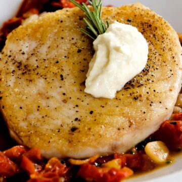 Closeup of Weight Watchers Halibut With Spicy Vegetables in a white bowl.