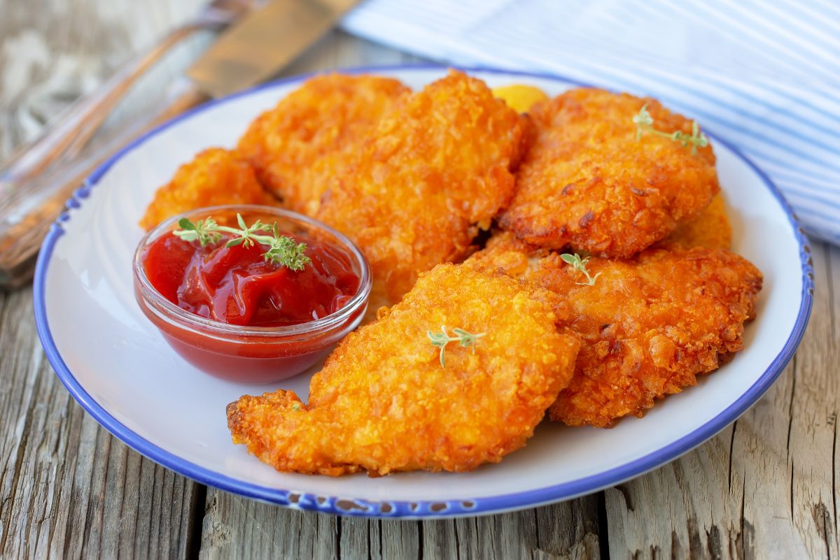 Weight Watchers Southern (Air) Fried Chicken on a white plate with a small dish of ketchup.