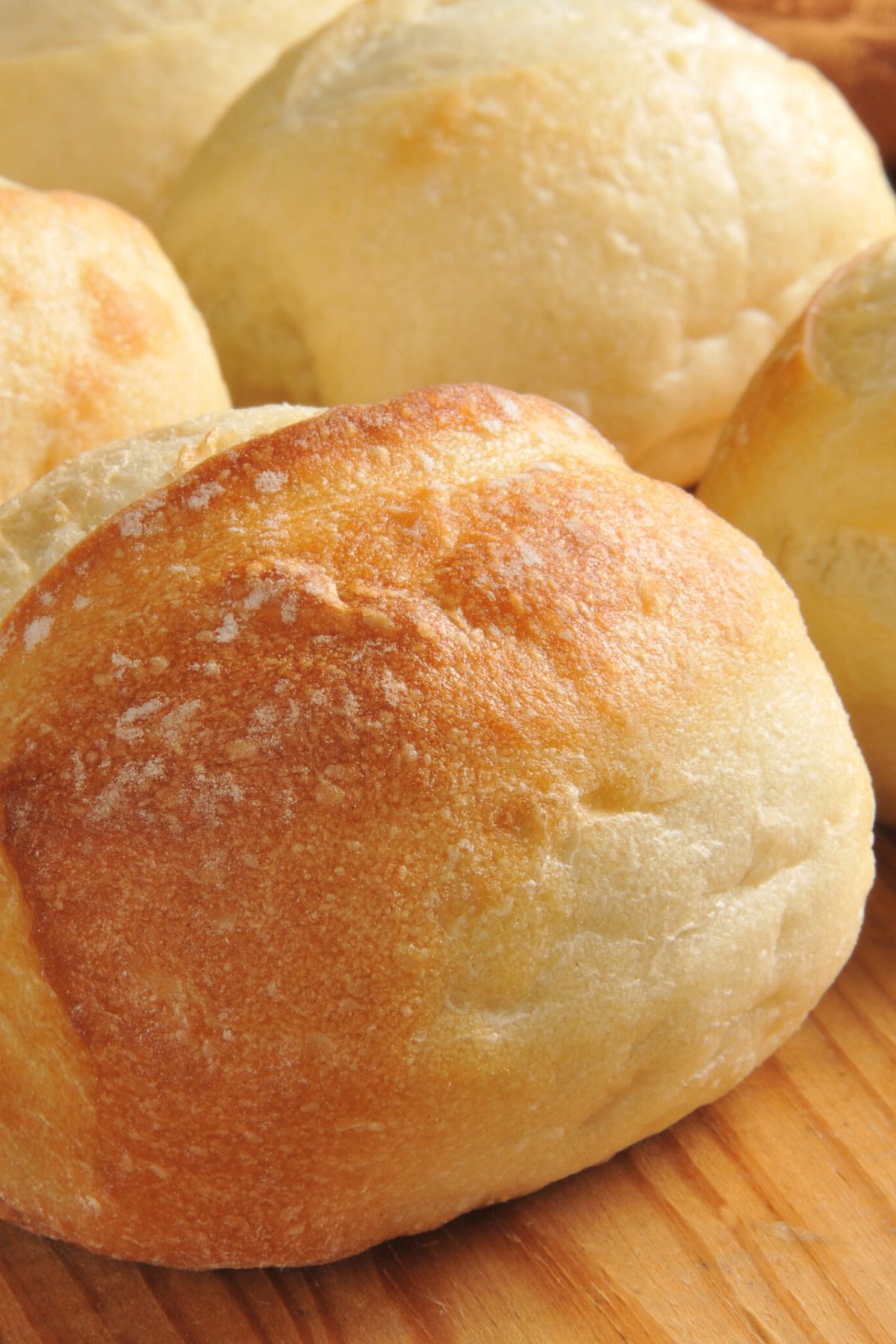 Closeup of Weight Watchers French Bread Rolls on a wooden surface.