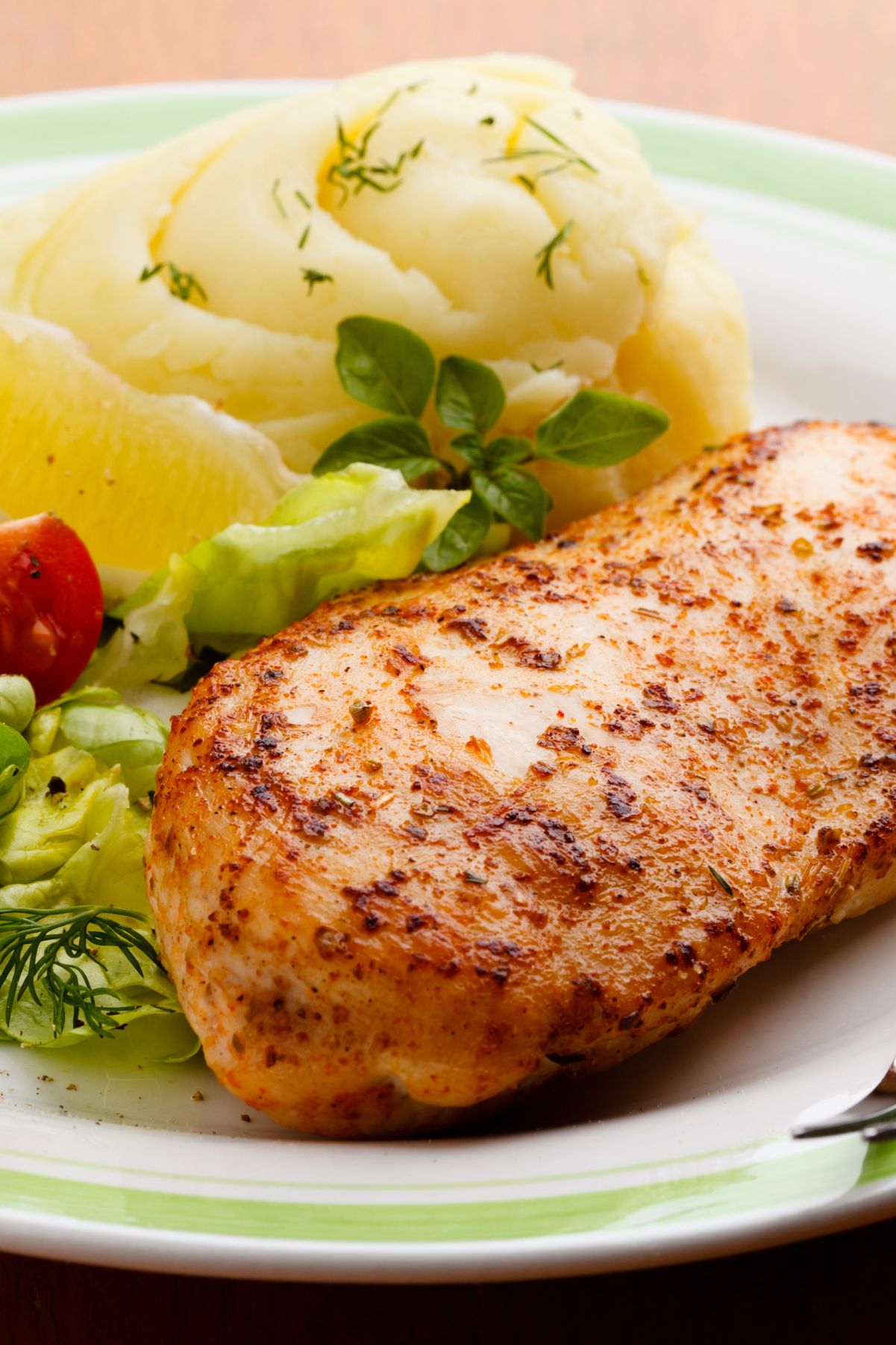 Closeup of Weight Watchers Lemon Pepper Chicken on a plate with mashed potatoes..