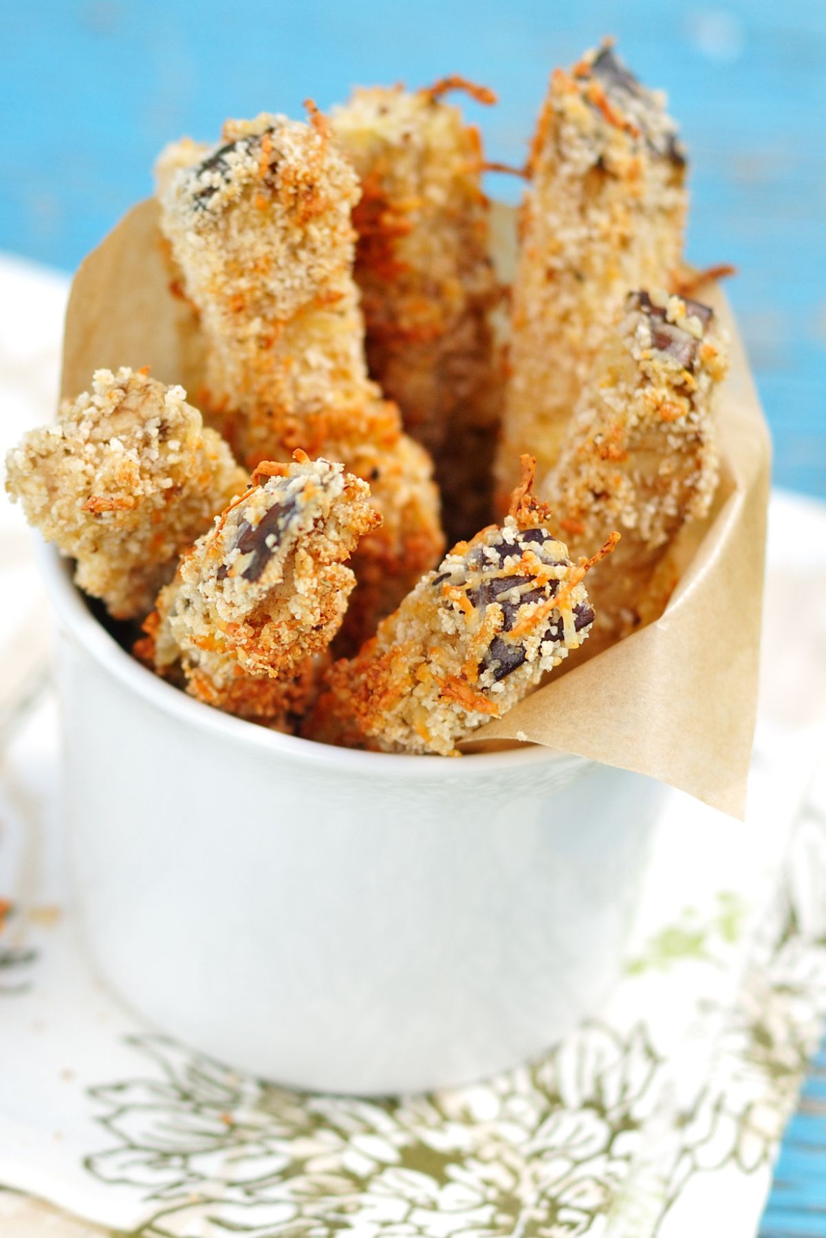 Closeup of Weight Watchers Parmesan Eggplant Fries in a white cup.