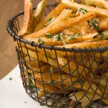 Weight Watchers Crispy Romano Cheese French Fries in a wire basket.