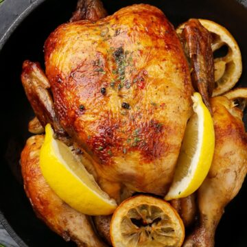 Closeup of Weight Watchers Meyer Lemon Roast Chicken in a black pot.