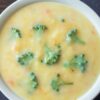 Closeup of Weight Watchers Quick Broccoli Cheddar Soup in a white bowl.