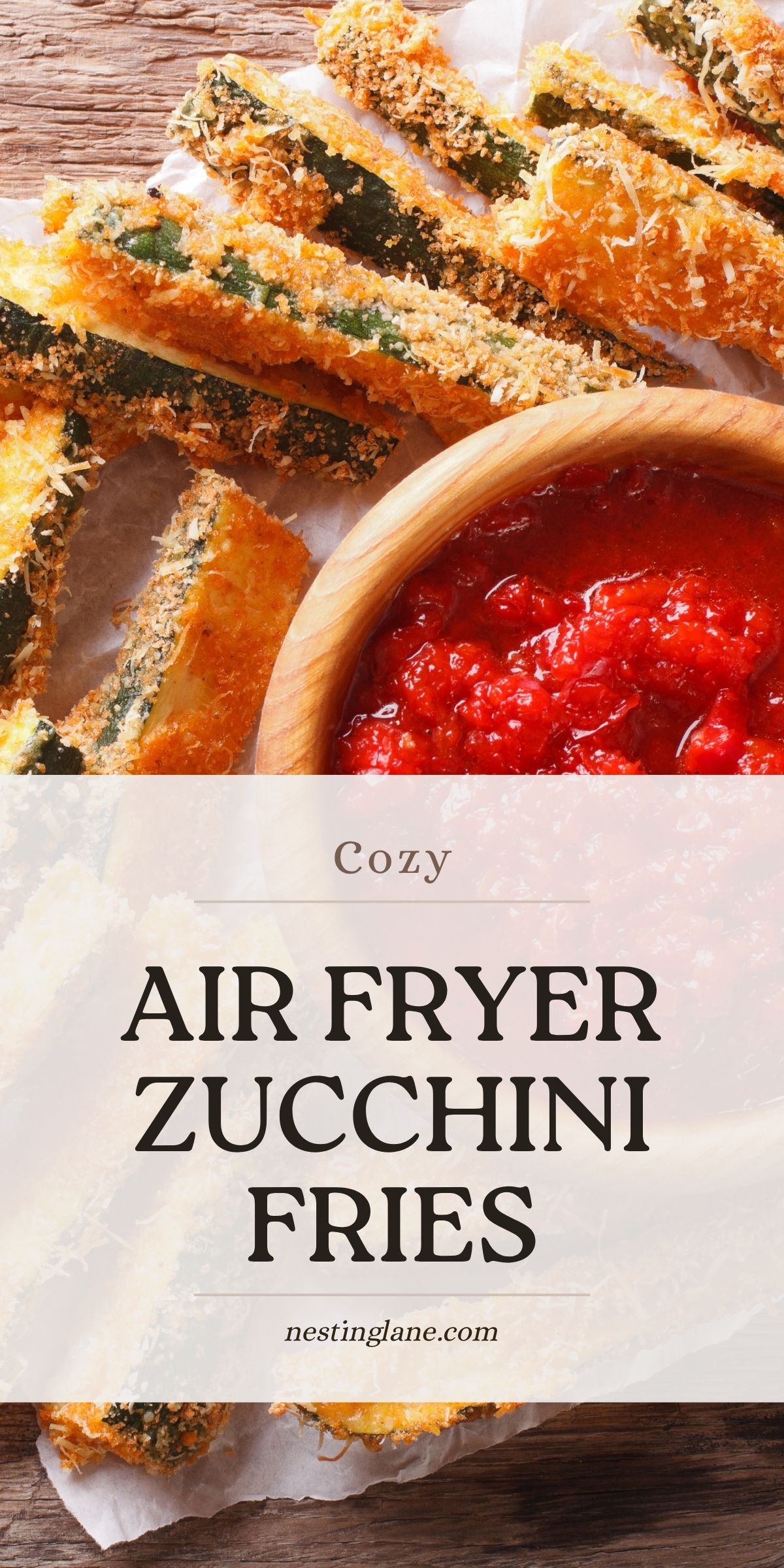 Closeup of Air Fryer Zucchini Fries with a cup of marinara sauce.