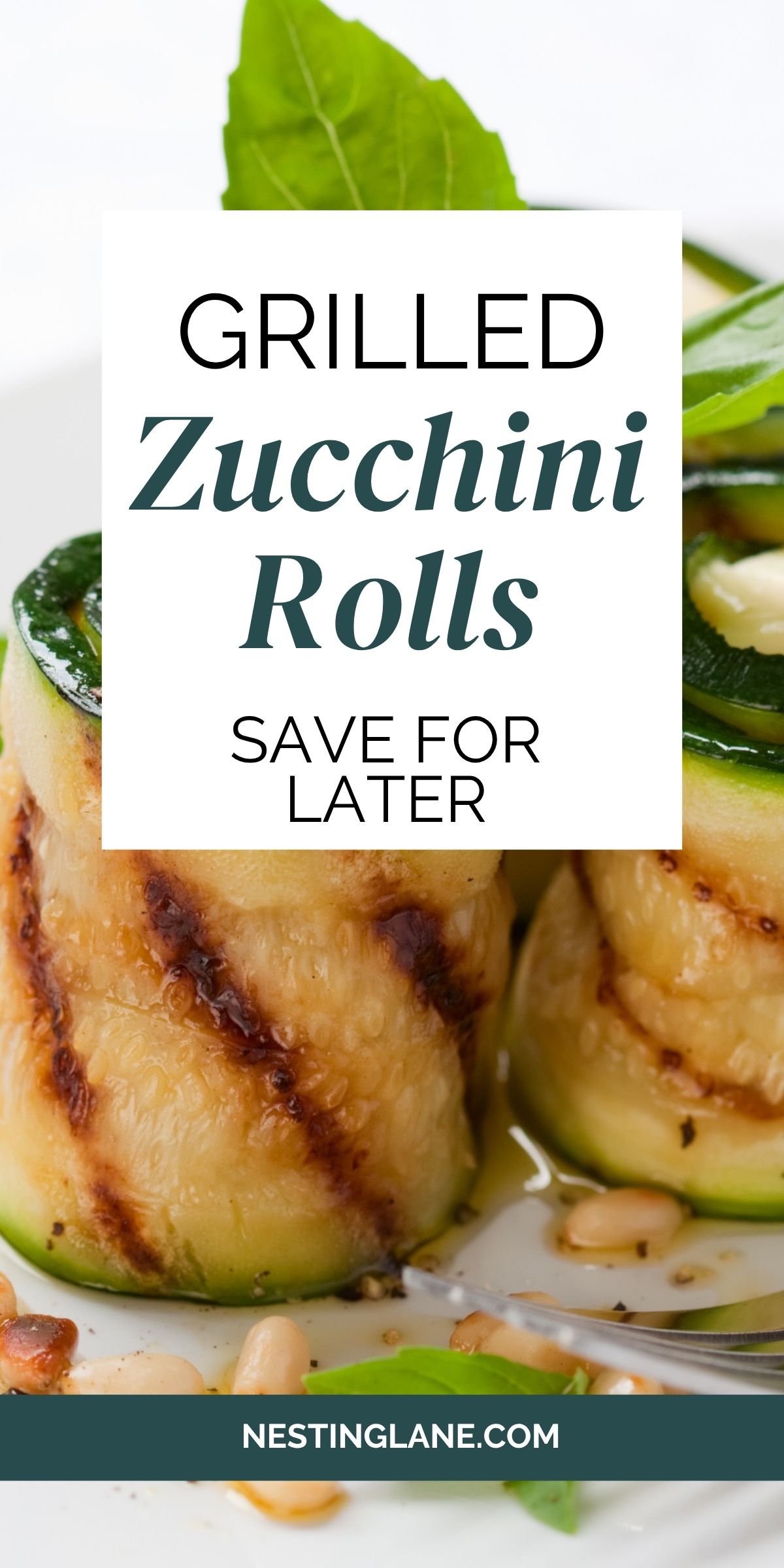 3 Cheesy Grilled Zucchini Rolls on a white plate.