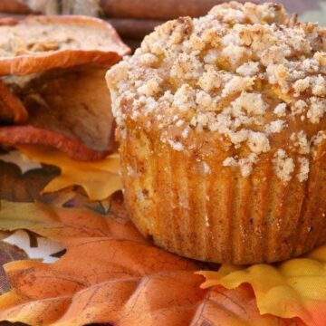Apple and Pumpkin Streusel Muffins on decorative faux autumn leaves.