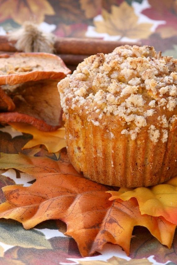 Apple and Pumpkin Streusel Muffins on decorative faux autumn leaves.