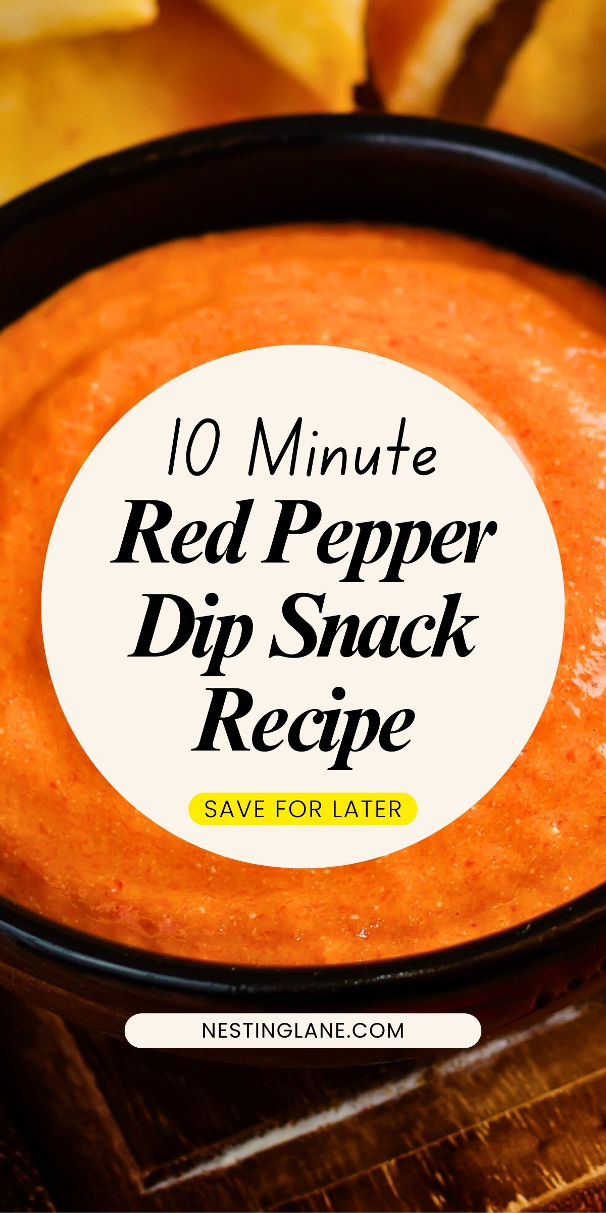 Close-up of a creamy red pepper dip in a black bowl, with a smooth, rich texture and vibrant orange-red color, served alongside golden tortilla chips. Text overlay reads “10 Minute Red Pepper Dip Snack Recipe” with “Save for Later” and “nestinglane.com” at the bottom.