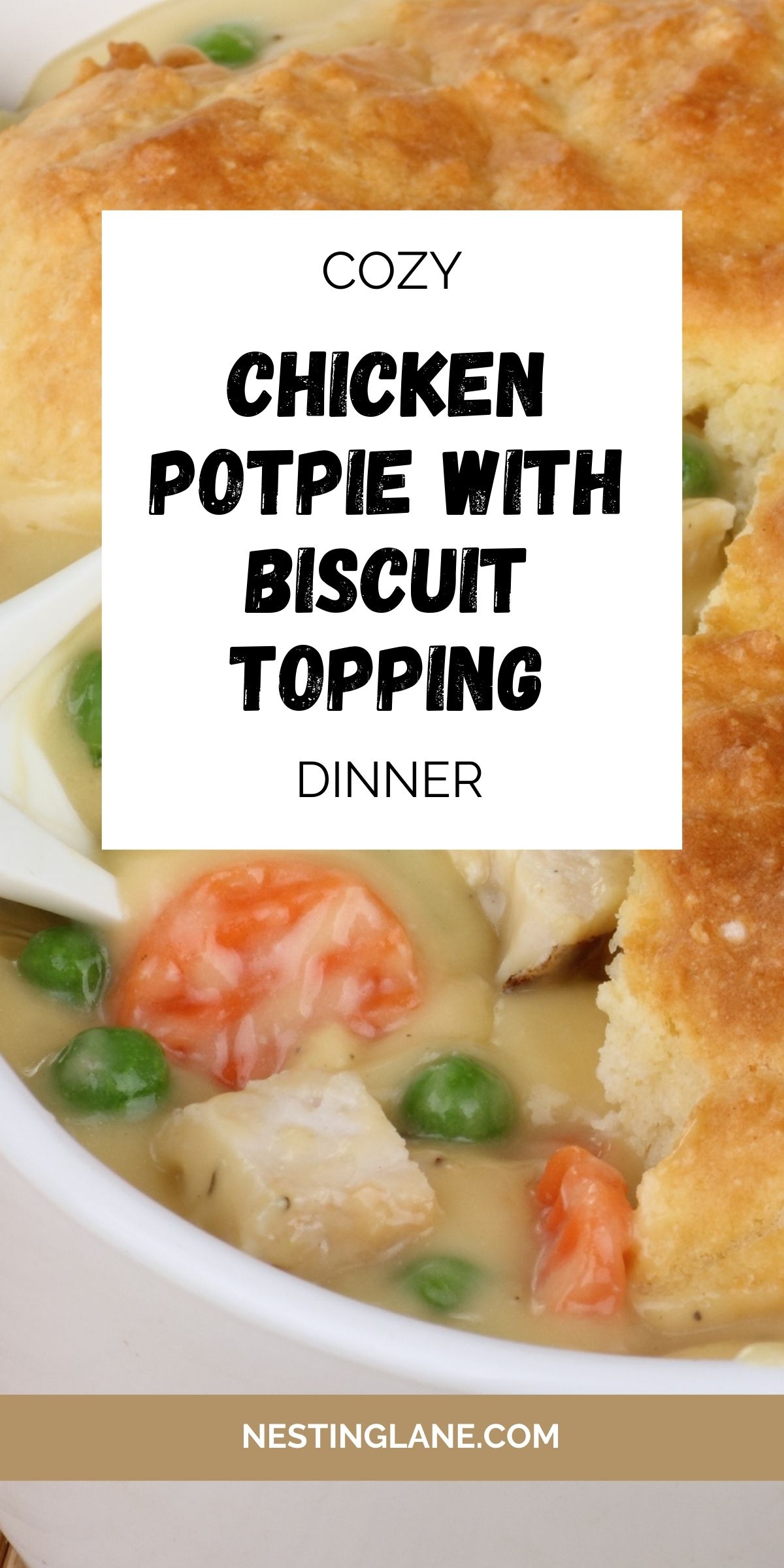 Golden biscuit topping sits over a creamy chicken potpie filled with carrots, peas, and tender chicken in rich gravy. A comforting dinner recipe showcased in a white bowl with a close-up view of the flaky crust and hearty filling. Text overlay reads “Cozy Chicken Potpie with Biscuit Topping Dinner” with website NestingLane.com.