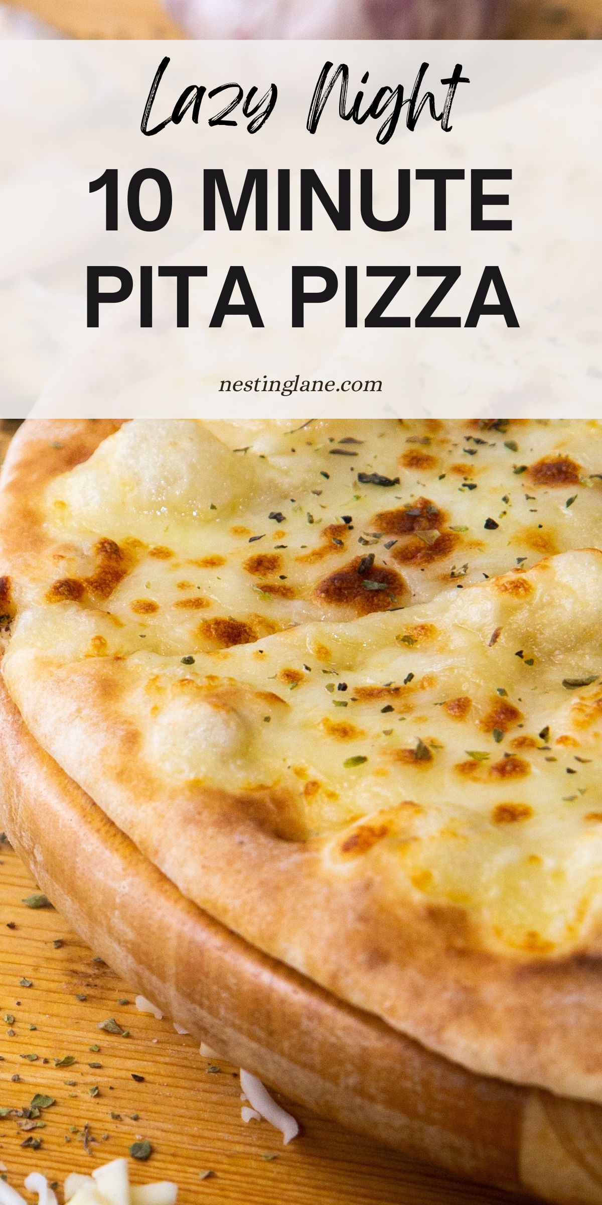 Close-up of a cheesy pita pizza with golden, bubbly melted mozzarella and herbs on a wooden board. Text reads: “Lazy Night 10 Minute Pita Pizza” and “nestinglane.com.” Quick weeknight dinner, easy pizza recipe, pita bread crust.