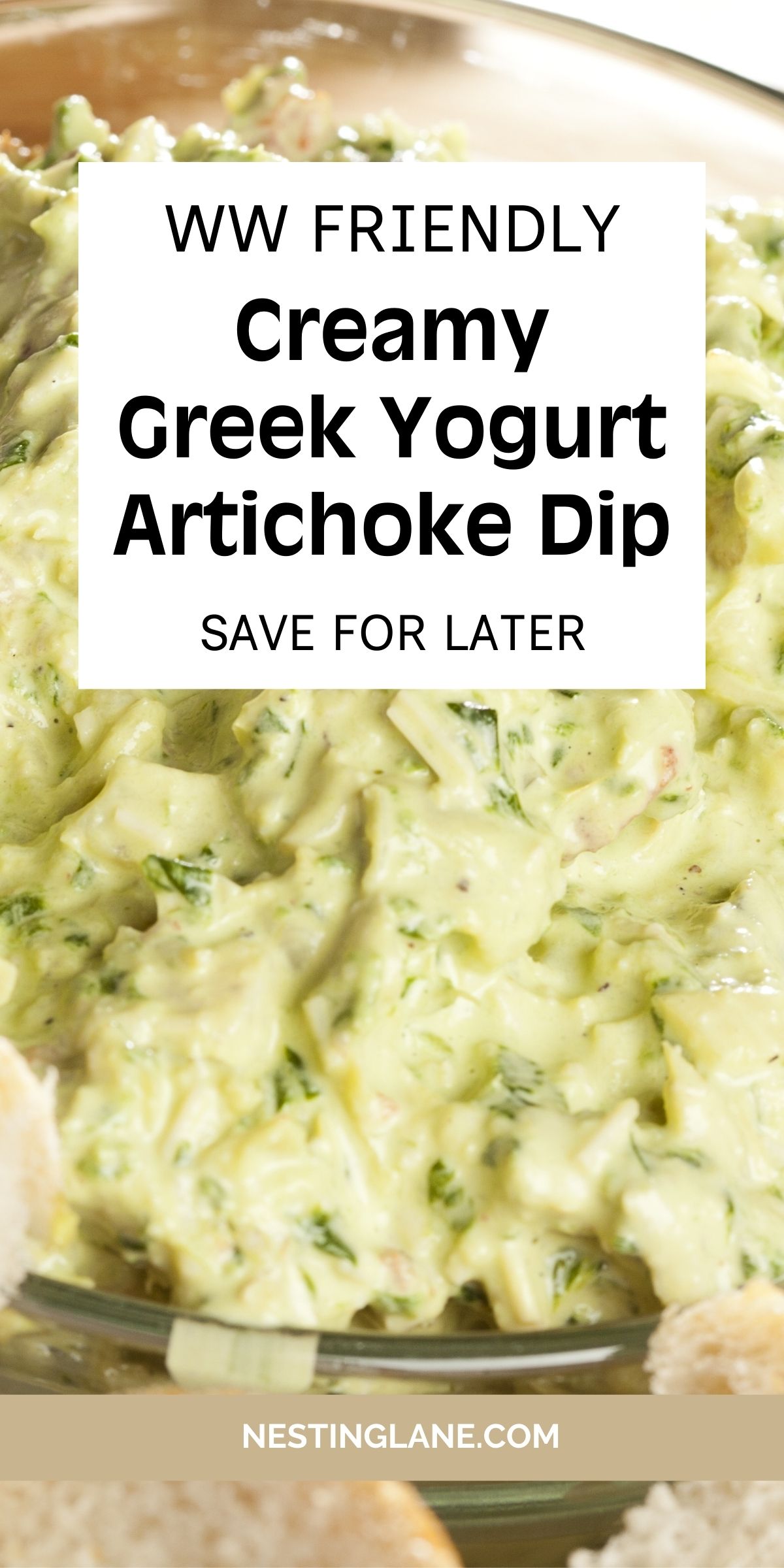 Creamy Greek yogurt artichoke dip in a glass bowl, thick and pale green with chopped artichokes and herbs. Text overlay reads “WW FRIENDLY Creamy Greek Yogurt Artichoke Dip” and “SAVE FOR LATER,” with “NESTINGLANE.COM” at the bottom. Close-up food photography highlighting the smooth, creamy dip texture.