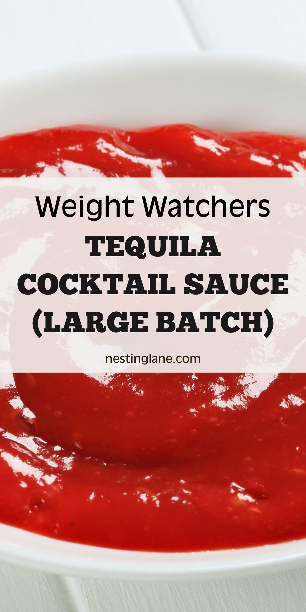 Close-up of thick red tequila cocktail sauce in a white bowl, glossy and smooth with visible texture. Text overlay reads “Weight Watchers Tequila Cocktail Sauce (Large Batch)” and “nestinglane.com” on a soft white banner. Clean, minimal food photography with a white background.