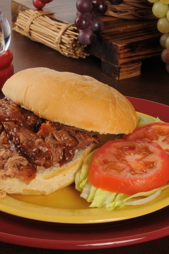 Slow Cooker Texas Style Pulled Pork on a red plate.
