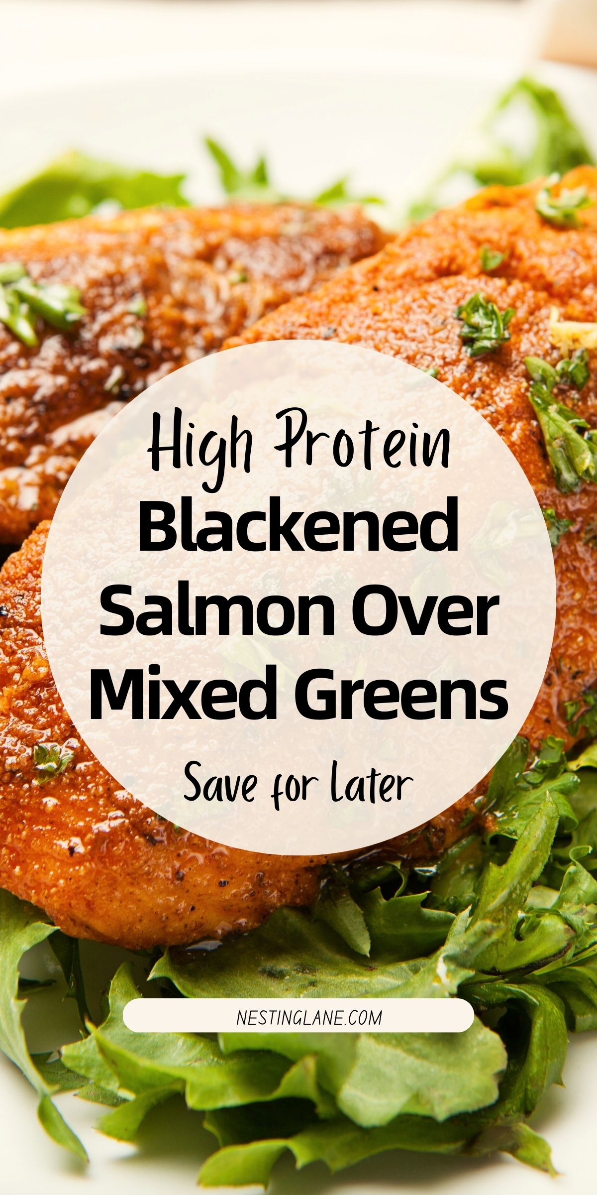 Blackened salmon fillets with a dark spiced crust served over mixed leafy greens. Salmon is garnished with chopped herbs and rests on fresh greens. Overlaid text reads “High Protein Blackened Salmon Over Mixed Greens” and “Save for Later.” Branding text at the bottom says “nestinglane.com.”