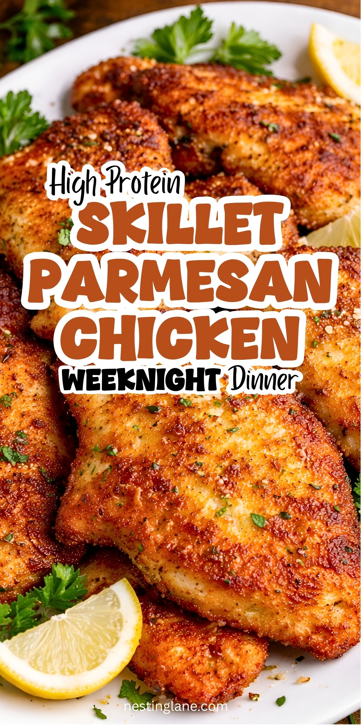 Golden brown breaded Parmesan chicken cutlets on a white plate with lemon wedges and parsley. Text overlay reads: “High Protein Skillet Parmesan Chicken” and “Weeknight Dinner.” Nestinglane.com appears at the bottom.